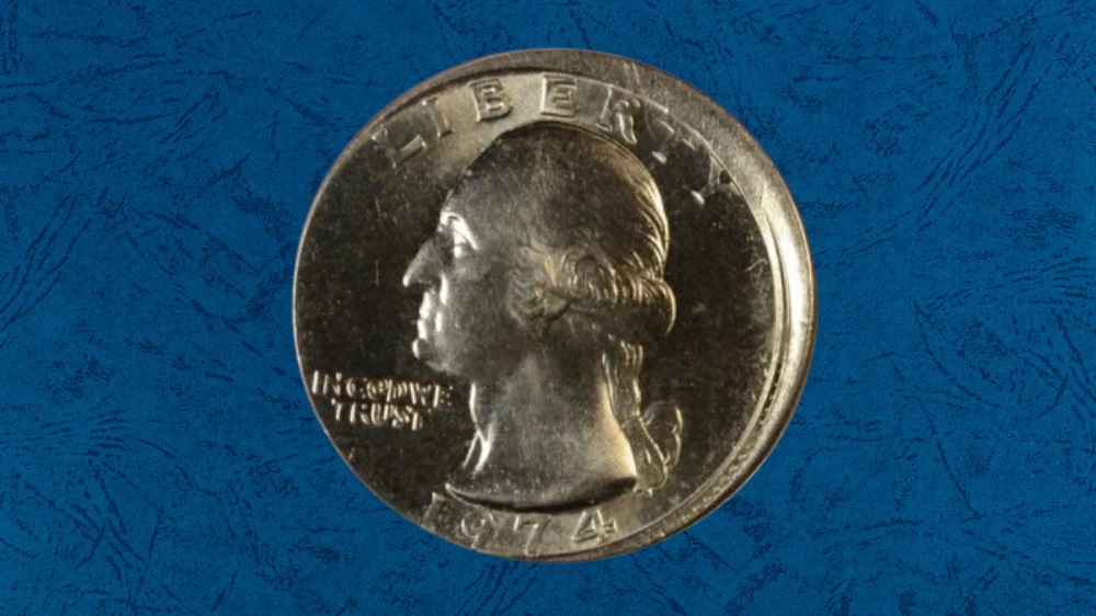 1974 quarter off-center strike showing design shifted to one side with large blank crescent area and date 1974 visible